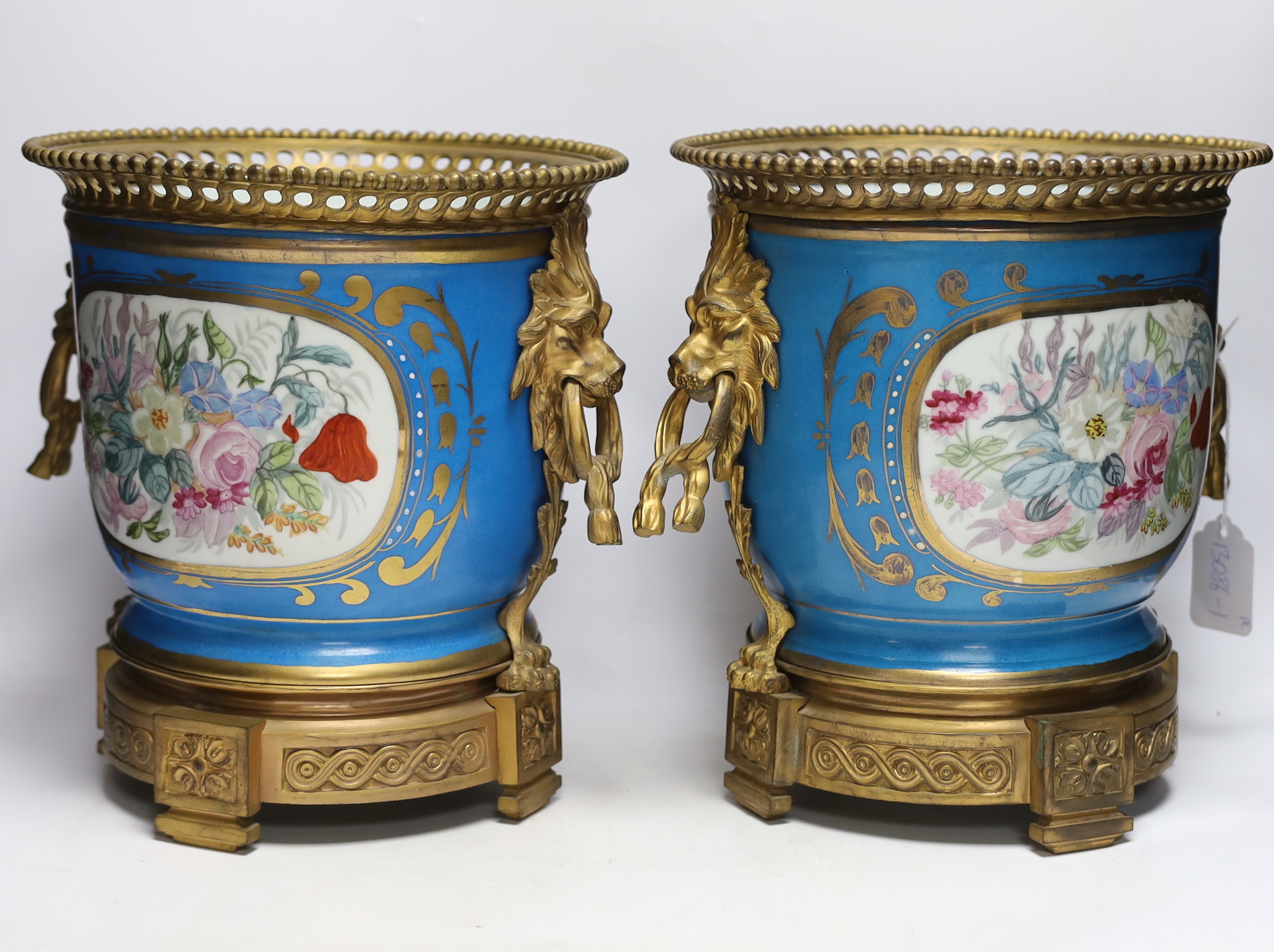 A pair of ormolu mounted Sevres style cache pots, 29cm high